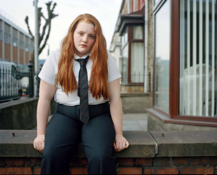 Abbie Trayler-Smith  Deana hangs out outside her house after school in Port Talbot, Wales.  Deena is now 12 and has been overweight since she was little. She tells me she feels more comfortable than she used to as there are more overweight kids in her class than there used to be.from the series, The Big O, an intimate portrait of the children behind the obesity statistics in Britain.
